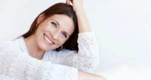 woman smiling after dermal filler treatment at apsaras clinic