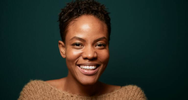 Woman smiling with smooth skin after dermal fillers